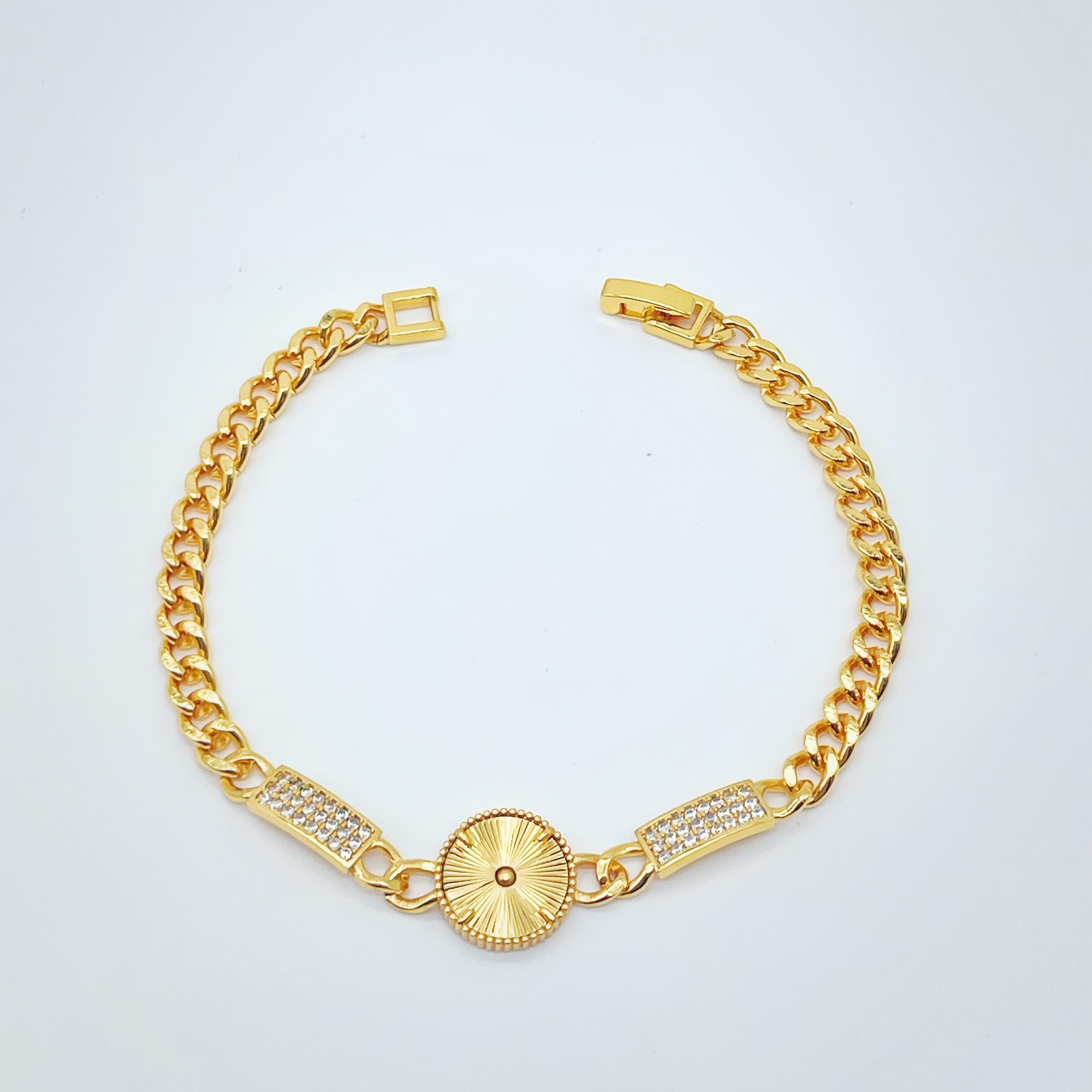 Golden Tone Bracelet with Sunburst Charm & Cubic Zirconia Accents